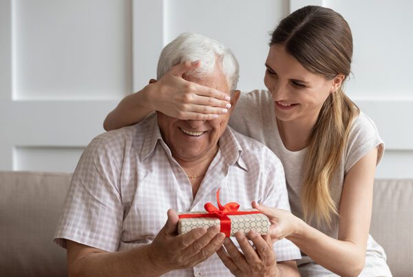 Turning 65 and Medicare - Older Man is Blind Folded as Daughter Gives Him a Gift for His Birthday at Home